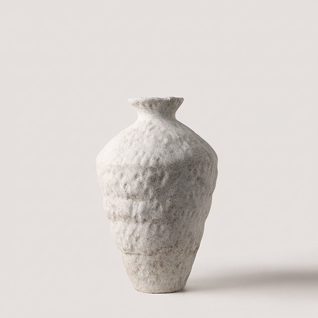 Small tall organic ceramic vase in matte white, narrow neck and rounded base