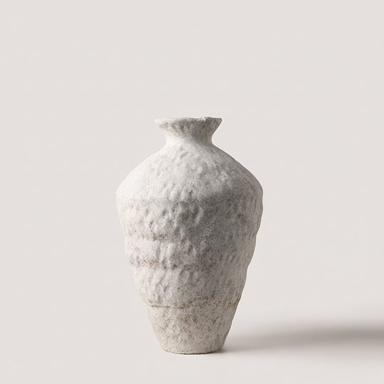 Small tall organic ceramic vase in matte white, narrow neck and rounded base