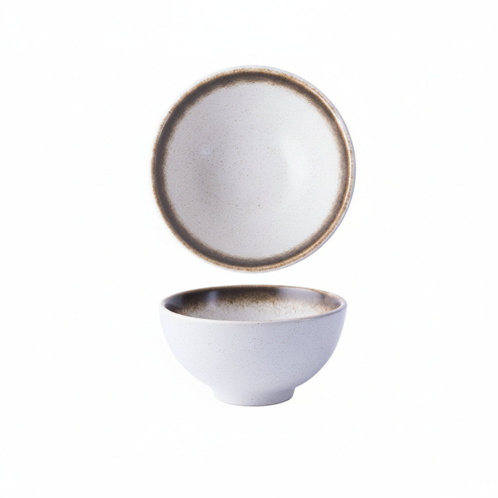 Small ceramic catch bowl in daytime glaze, warm light tenmoku finish