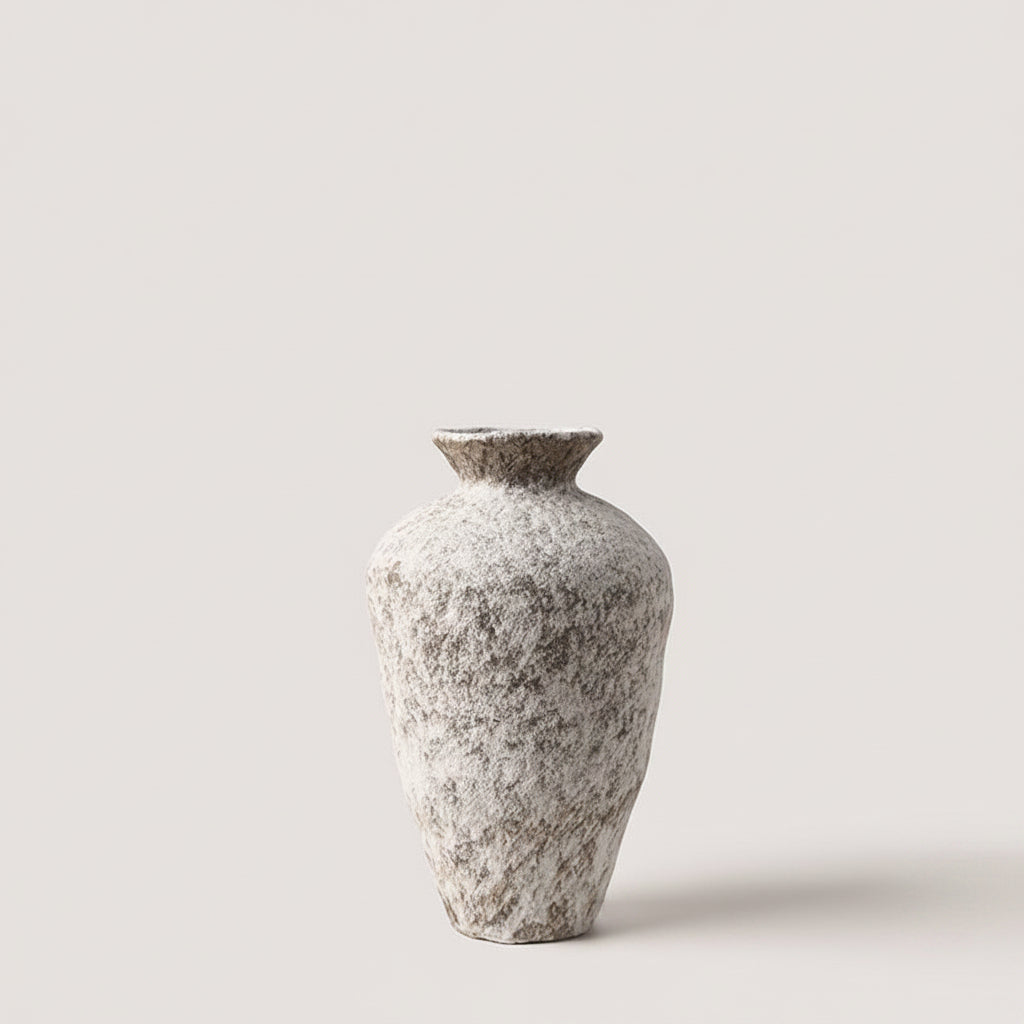 Small tall organic ceramic vase in matte white, narrow neck and rounded base