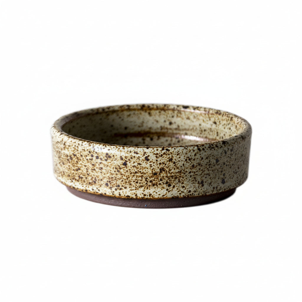 Rough pottery mug with retro glaze showing intentional surface variation